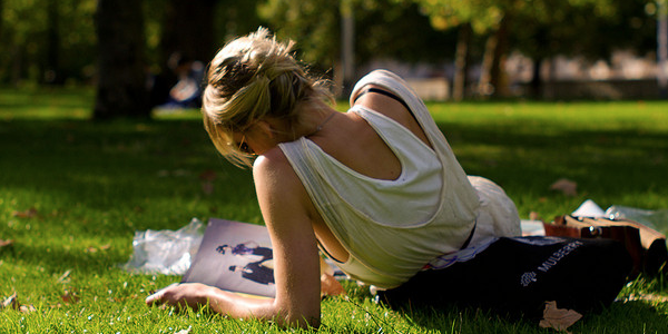 magazine reader in park