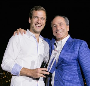 Chango founder Chris Sukornyk (left) receiving his award from John Albright of Relay Ventures