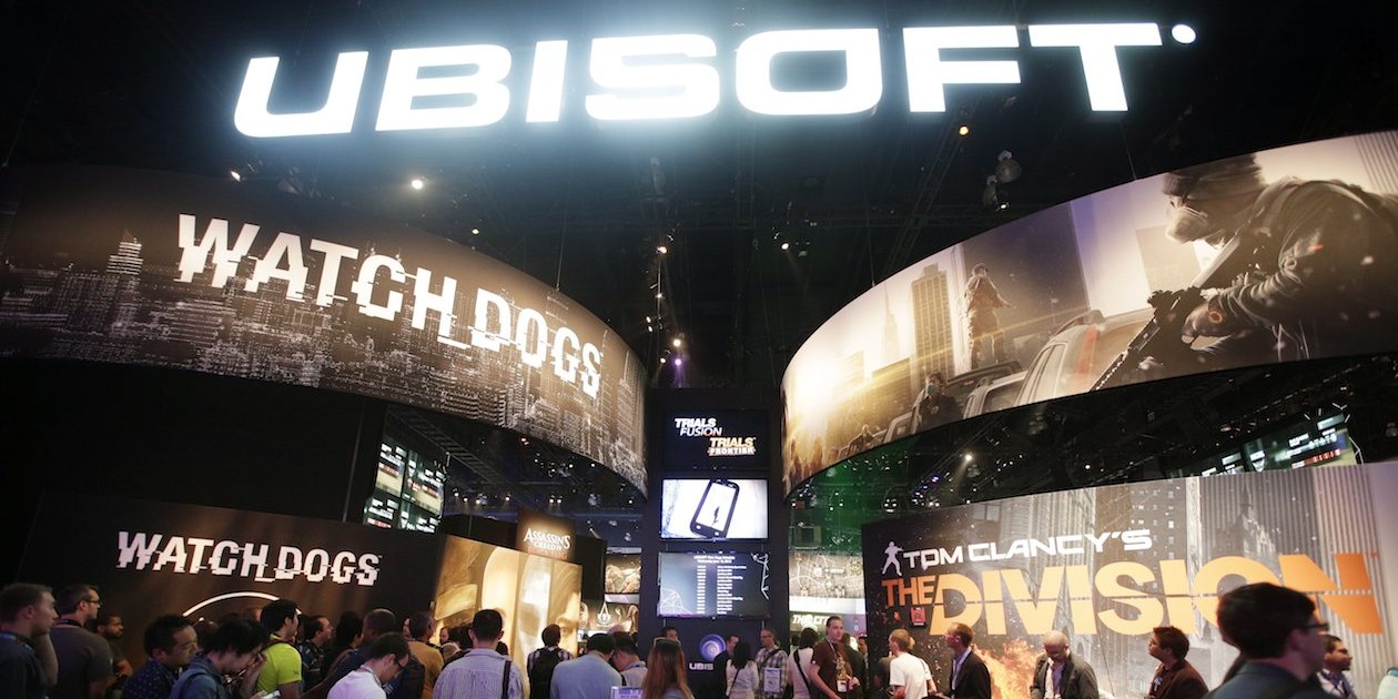 FILE - This June 12, 2013 file photo shows attendees waiting in line for  presentations on the video games, "Watch Dogs" and "Tom Clancy's The Division" at the Ubisoft booth during the Electronic Entertainment Expo in Los Angeles. The recent success of "Watch Dogs" and "Titanfall" is paving the way for several new video games that don't contain numbers in their titles to be hyped at next week's Electronic Entertainment Expo, the gaming industry's annual trade show held on June 10-12, 2014, in Los Angeles. With anticipation mounting for original games like “Destiny,” “The Order: 1886” and “Sunset Overdrive,” have game makers finally discovered the cure for sequelitis? (AP Photo/Jae C. Hong, file)