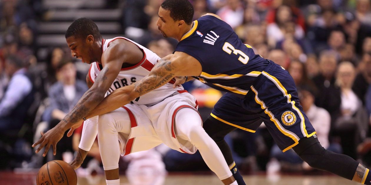 Toronto Raptors guard Delon Wright (55) nearly has the ball stripped away by Indiana Pacers guard George Hill (3) during the second half of NBA Basketball action in Toronto on Friday, April 8, 2016. It's a dream come true for Delon and Dorell Wright, who face off when Raptors host Heat in round two of the NBA playoffs. THE CANADIAN PRESS/Peter Power