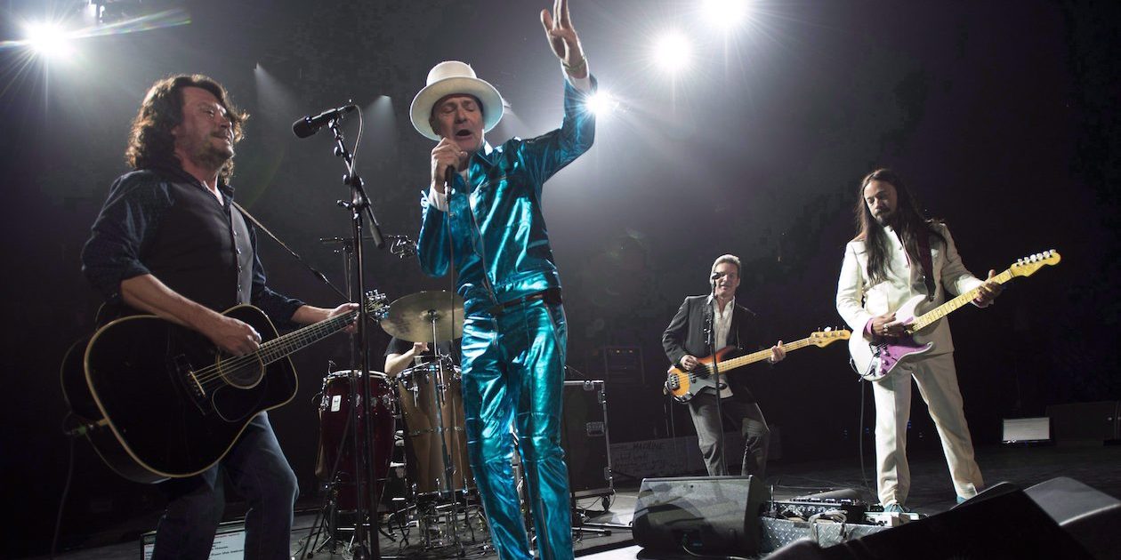 Frontman of the Tragically Hip, Gord Downie, centre, leads the band through a concert in Vancouver on July, 24, 2016. Canada's insatiable appetite for the Tragically Hip sent the rock band's entire discography back onto the Billboard charts last week. THE CANADIAN PRESS/Jonathan Hayward