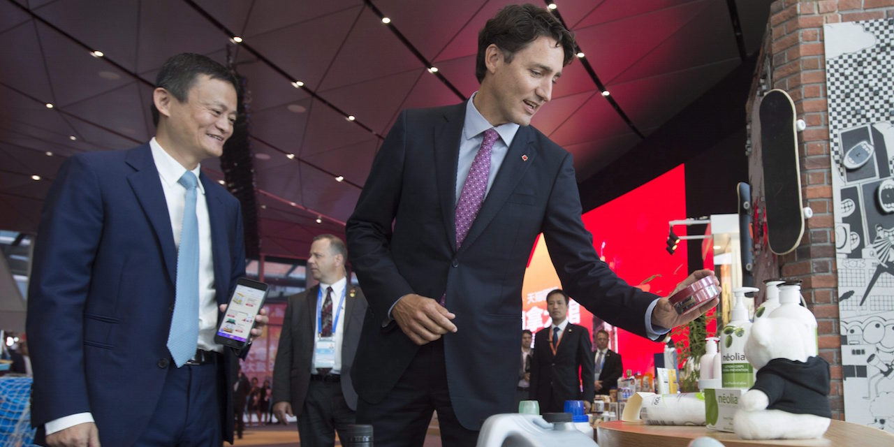 Alibaba Chairman Jack Ma, left, and Canadian Prime Minister Justin Trudeau talk about Canadian products following an announcement in Hangzhou, China, on Saturday, September 3, 2016. THE CANADIAN PRESS/Adrian Wyld